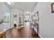 Hallway showcasing hardwood floors, tasteful decor, and access to other rooms at 2829 Maple Brook Loop, Lutz, FL 33558