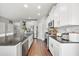 Kitchen with granite countertops, stainless appliances, and abundant cabinet storage at 2829 Maple Brook Loop, Lutz, FL 33558