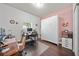 Versatile office space featuring an armoire bed, and wood floors at 2829 Maple Brook Loop, Lutz, FL 33558