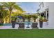 Inviting backyard with a pool, comfortable lounge chairs, and lush tropical landscaping for relaxation and privacy at 2902 S Beach Dr, Tampa, FL 33629