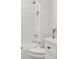 Modern bath featuring decorative tile wall, glass shower door, and white vanity at 2902 S Beach Dr, Tampa, FL 33629