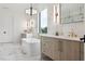 Bright bathroom featuring marble floors, a freestanding tub, and modern vanities offering a spa-like experience at 2902 S Beach Dr, Tampa, FL 33629