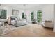 Cozy bedroom with hardwood floors, soft natural light, and modern furnishings at 2902 S Beach Dr, Tampa, FL 33629