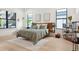 Bright bedroom with hardwood floors, large windows, and a comfortable king-size bed at 2902 S Beach Dr, Tampa, FL 33629
