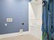 Dog wash station with white subway tile surround and built-in dog leash rack at 2902 S Beach Dr, Tampa, FL 33629