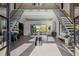 Grand foyer with a striking staircase, bright lighting, and elegant decor at 2902 S Beach Dr, Tampa, FL 33629