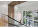 Stunning two-story foyer featuring a modern chandelier, wood accents, and large windows at 2902 S Beach Dr, Tampa, FL 33629