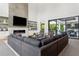 Spacious modern living room featuring a fireplace, built-in shelving, and sliding glass doors at 2902 S Beach Dr, Tampa, FL 33629
