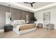 A luxurious bedroom with a textured accent wall, pendant lights, and modern furniture offers a relaxing retreat at 2902 S Beach Dr, Tampa, FL 33629