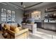 Sophisticated office with a gray color scheme, functional desk setup, and decorative shelving at 2902 S Beach Dr, Tampa, FL 33629