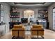 Stylish office with a gray color scheme, modern desk setup, and decorative shelving at 2902 S Beach Dr, Tampa, FL 33629