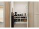 Walk-in pantry with stocked shelves and modern appliances for optimal organization and convenience at 2902 S Beach Dr, Tampa, FL 33629