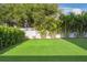 Backyard putting green with lush artificial turf, perfect for golf enthusiasts and outdoor recreation at 2902 S Beach Dr, Tampa, FL 33629