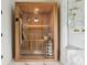 Enjoy a relaxing spa experience in the sauna with a glass front next to a steam shower at 2902 S Beach Dr, Tampa, FL 33629