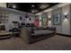 Basement home theater featuring projector, surround sound, and large sectional seating at 2902 S Beach Dr, Tampa, FL 33629