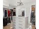 Spacious walk-in closet with custom shelving, drawers, and modern lighting at 2902 S Beach Dr, Tampa, FL 33629