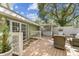Inviting backyard patio with outdoor seating area and bar, surrounded by lush greenery and privacy fence at 301 81St Ne Ave, St Petersburg, FL 33702