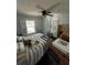 This bedroom has a ceiling fan and windows with shutters at 301 81St Ne Ave, St Petersburg, FL 33702