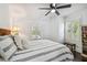 This main bedroom is bright with two windows and shutters at 301 81St Ne Ave, St Petersburg, FL 33702