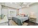 Inviting bedroom featuring natural light, plush bedding, and a cozy window seat perfect for relaxation at 301 81St Ne Ave, St Petersburg, FL 33702