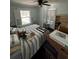 Cozy bedroom featuring a bed, natural light, and comfortable atmosphere at 301 81St Ne Ave, St Petersburg, FL 33702
