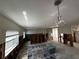 Renovate empty bonus room, ready for personalization, with double doors opening to the back of the home at 301 81St Ne Ave, St Petersburg, FL 33702