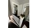 A hallway overlooks both the upstairs bathroom and bedroom at 301 81St Ne Ave, St Petersburg, FL 33702