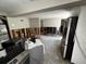 Open-concept kitchen with exposed walls, and stainless steel appliances, ready for transformation at 301 81St Ne Ave, St Petersburg, FL 33702