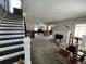 Open living area with staircase, fireplace and natural light ready for renovation and customization at 301 81St Ne Ave, St Petersburg, FL 33702