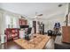 Large home office featuring hardwood floors, a ceiling fan, sports memorabilia, and a cozy desk area at 301 81St Ne Ave, St Petersburg, FL 33702