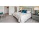 Bedroom with neutral carpet, ensuite bathroom, and views to the rear at 31450 Paper Birch St, Wesley Chapel, FL 33545