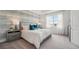 Tranquil main bedroom with a large window, soft lighting, and stylish decor, offering a relaxing retreat at 31458 Paper Birch St, Wesley Chapel, FL 33545