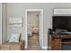 View from the living room into a bedroom with coastal themed decor at 3520 51St W Ave, Bradenton, FL 34210