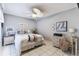Bedroom features a ceiling fan, nautical decor, and white tiled floors at 3520 51St W Ave, Bradenton, FL 34210