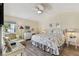 Comfortable bedroom features a ceiling fan, coastal decor, and a bright window at 3520 51St W Ave, Bradenton, FL 34210