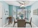 Cozy breakfast nook area with a round table and a ceiling fan at 3520 51St W Ave, Bradenton, FL 34210