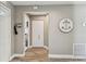 Entryway with wood floors, closet, and access to other rooms in the home at 3520 51St W Ave, Bradenton, FL 34210