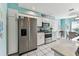 Bright kitchen featuring stainless steel appliances and white cabinetry at 3520 51St W Ave, Bradenton, FL 34210