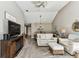 Bright living room boasts hardwood floors, ceiling fan, comfortable seating, and view into dining area at 3520 51St W Ave, Bradenton, FL 34210