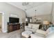 Coastal-inspired living room with hardwood floors, comfortable seating, and dining area in view at 3520 51St W Ave, Bradenton, FL 34210