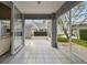 Covered and screened patio featuring tiled flooring and sliding glass doors at 3520 51St W Ave, Bradenton, FL 34210