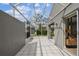 Tiled and screened-in patio area with overhead covering offering bright space at 3520 51St W Ave, Bradenton, FL 34210
