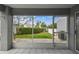 Screened-in patio area featuring a view of the landscaped backyard at 3520 51St W Ave, Bradenton, FL 34210
