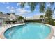 A community pool surrounded by lush greenery, offering a refreshing oasis for residents to enjoy at 3520 51St W Ave, Bradenton, FL 34210