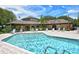 Community pool with ample seating around the perimeter, providing a relaxing and social space for residents at 3520 51St W Ave, Bradenton, FL 34210