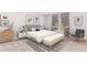 Stylish main bedroom with neutral tones, ample natural light, and decorative accents at 35695 Lockman Way, Zephyrhills, FL 33541