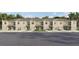 Inviting townhomes feature a neutral color palette and well-maintained landscaping, offering an attractive exterior at 3633 Copper Beech Dr, Land O Lakes, FL 34638