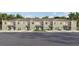 Newly constructed townhomes featuring individual garages, manicured lawns, and neutral two-tone color schemes at 3637 Copper Beech Dr, Land O Lakes, FL 34638
