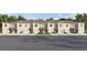 Newly constructed townhomes featuring individual garages, manicured lawns, and neutral two-tone color schemes at 3637 Copper Beech Dr, Land O Lakes, FL 34638