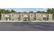Newly constructed townhomes featuring individual garages, manicured lawns, and neutral two-tone color schemes at 3637 Copper Beech Dr, Land O Lakes, FL 34638